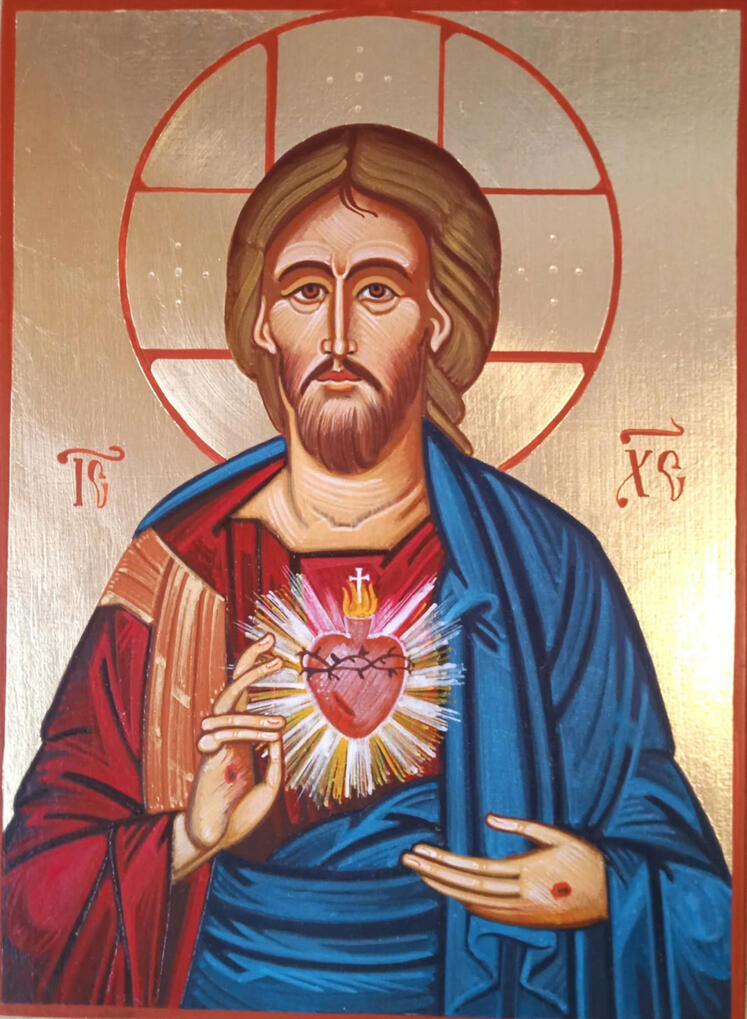 "Icona del Sacro Cuore di Gesù dipinta a mano da Nicola Damiano, in stile tradizionale bizantino/ortodosso. Cristo è raffigurato a mezzo busto con una veste rossa e un mantello blu, la mano destra alzata in segno di benedizione e la sinistra che indica il